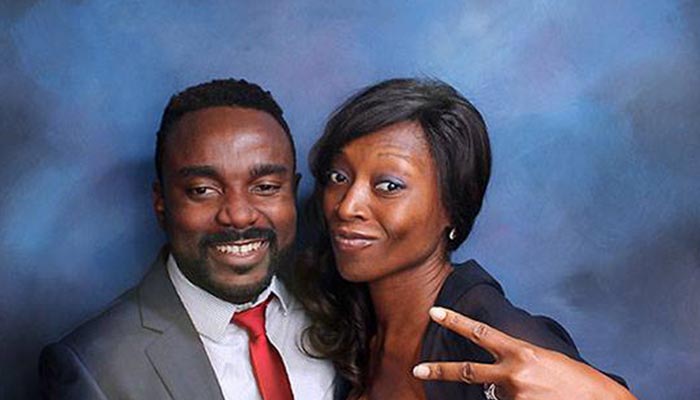 A man and woman posing for a picture.