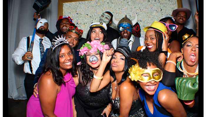 A group of people wearing masks and hats.