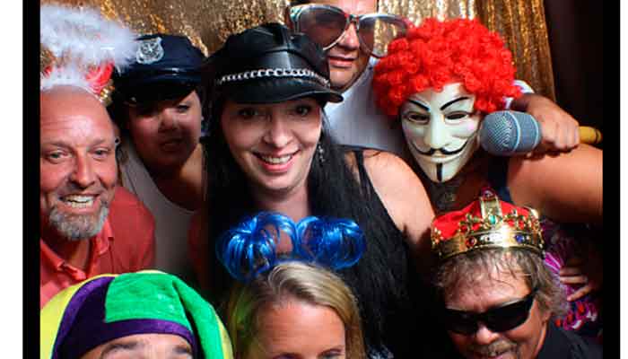 A group of people wearing costumes and hats.