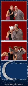 Two people posing for a photo booth with hats on.