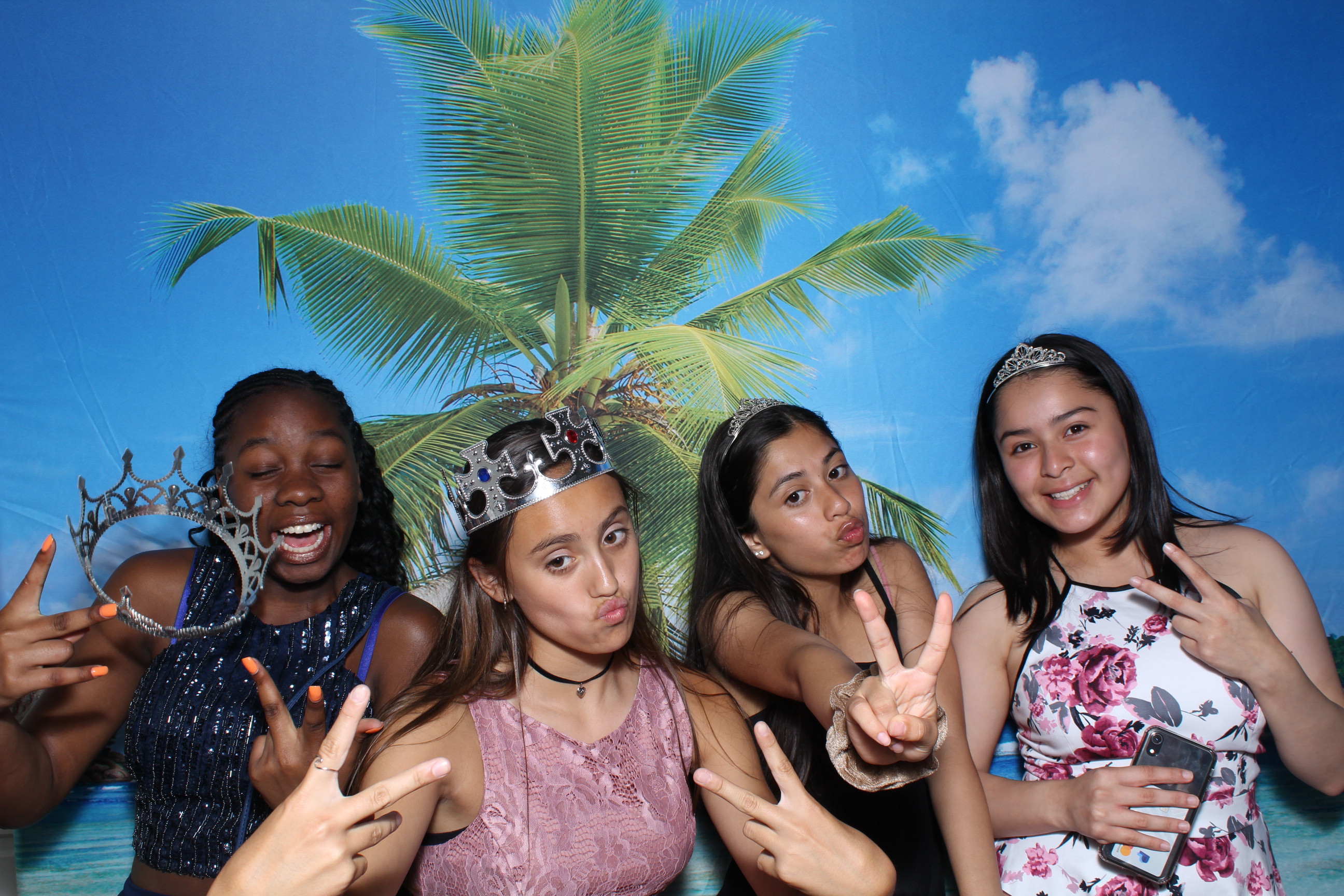 A group of girls posing for the camera.