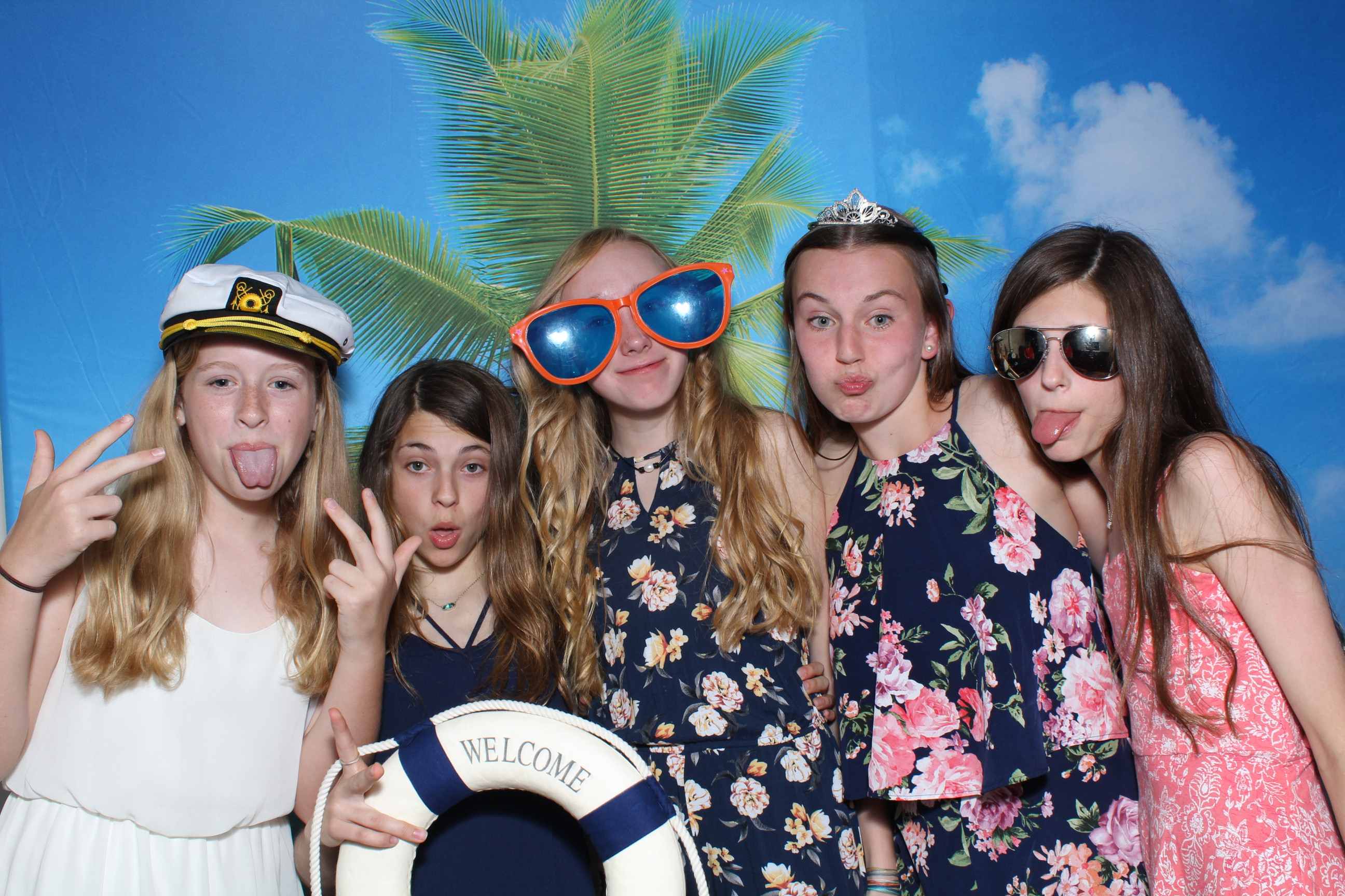A group of girls posing for the camera.
