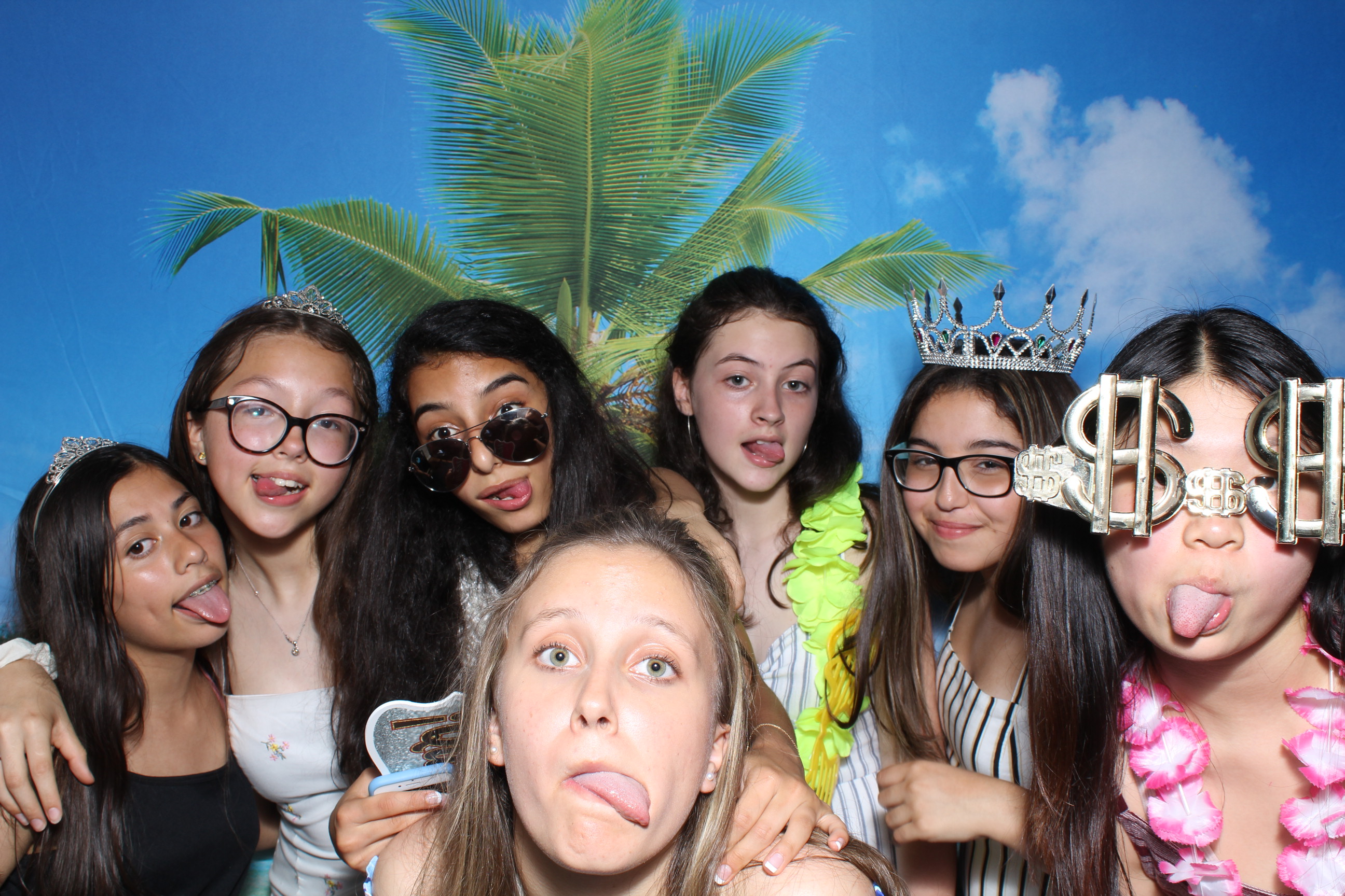 A group of girls posing for the camera.