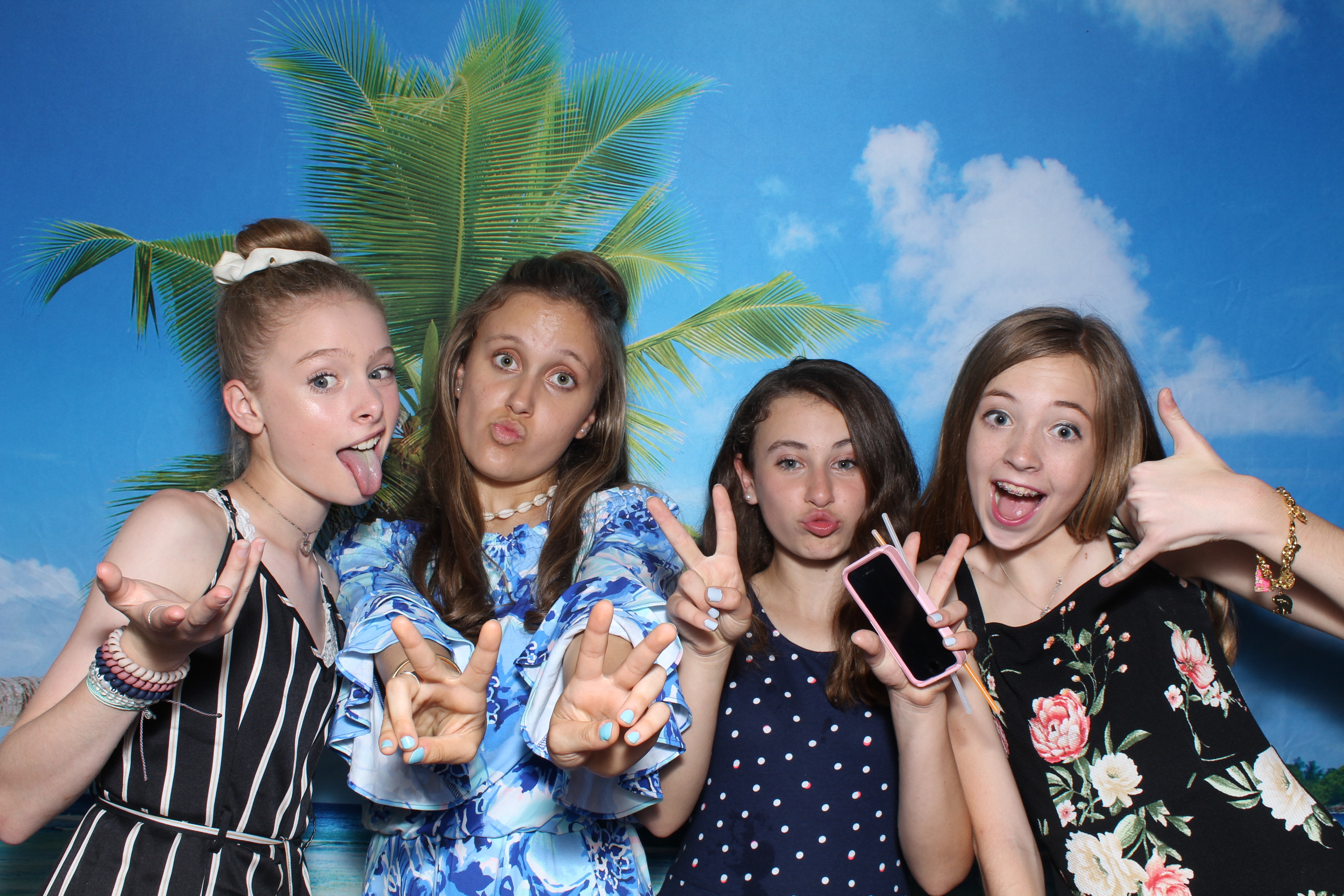 A group of girls posing for the camera.