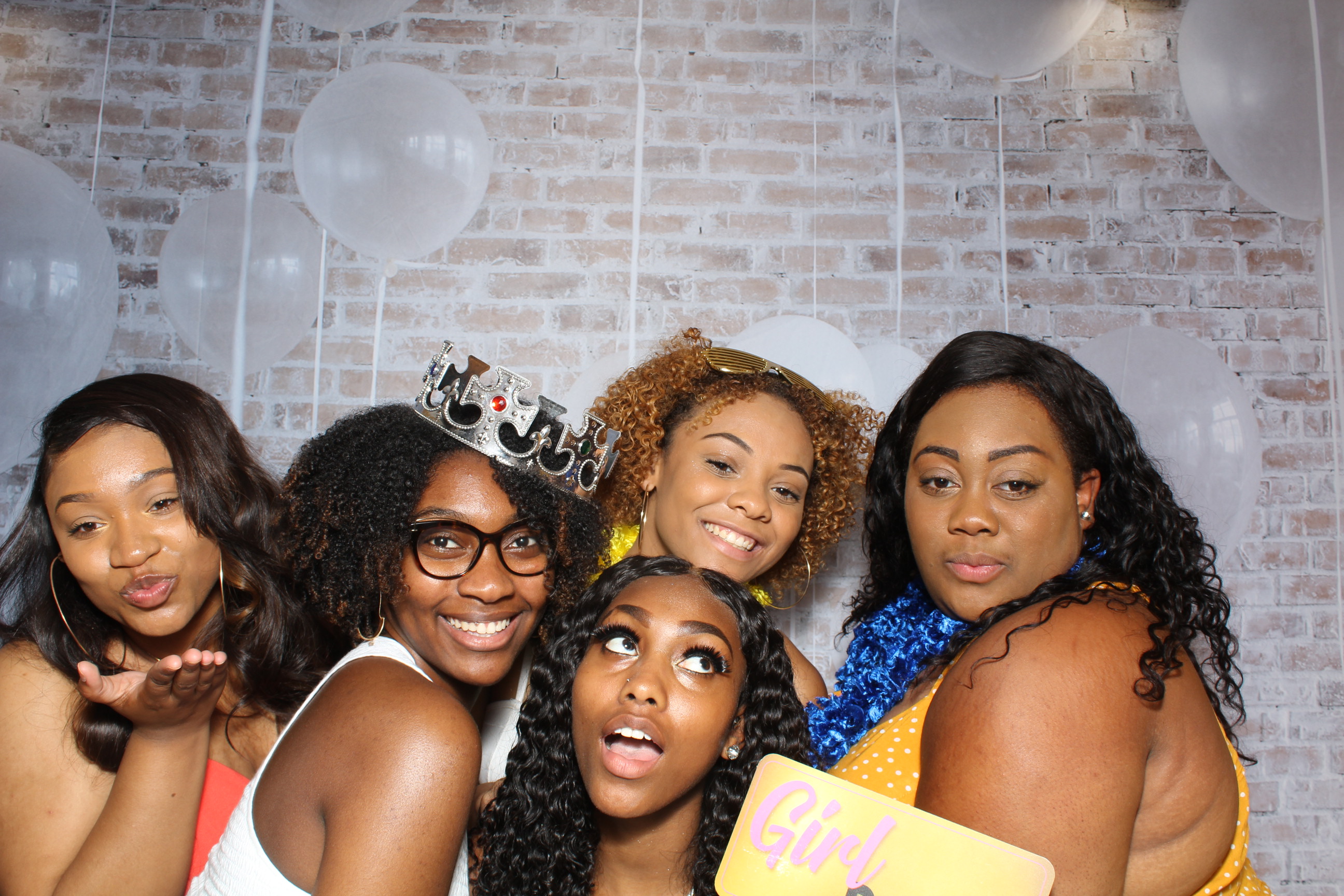 A group of women posing for the camera.