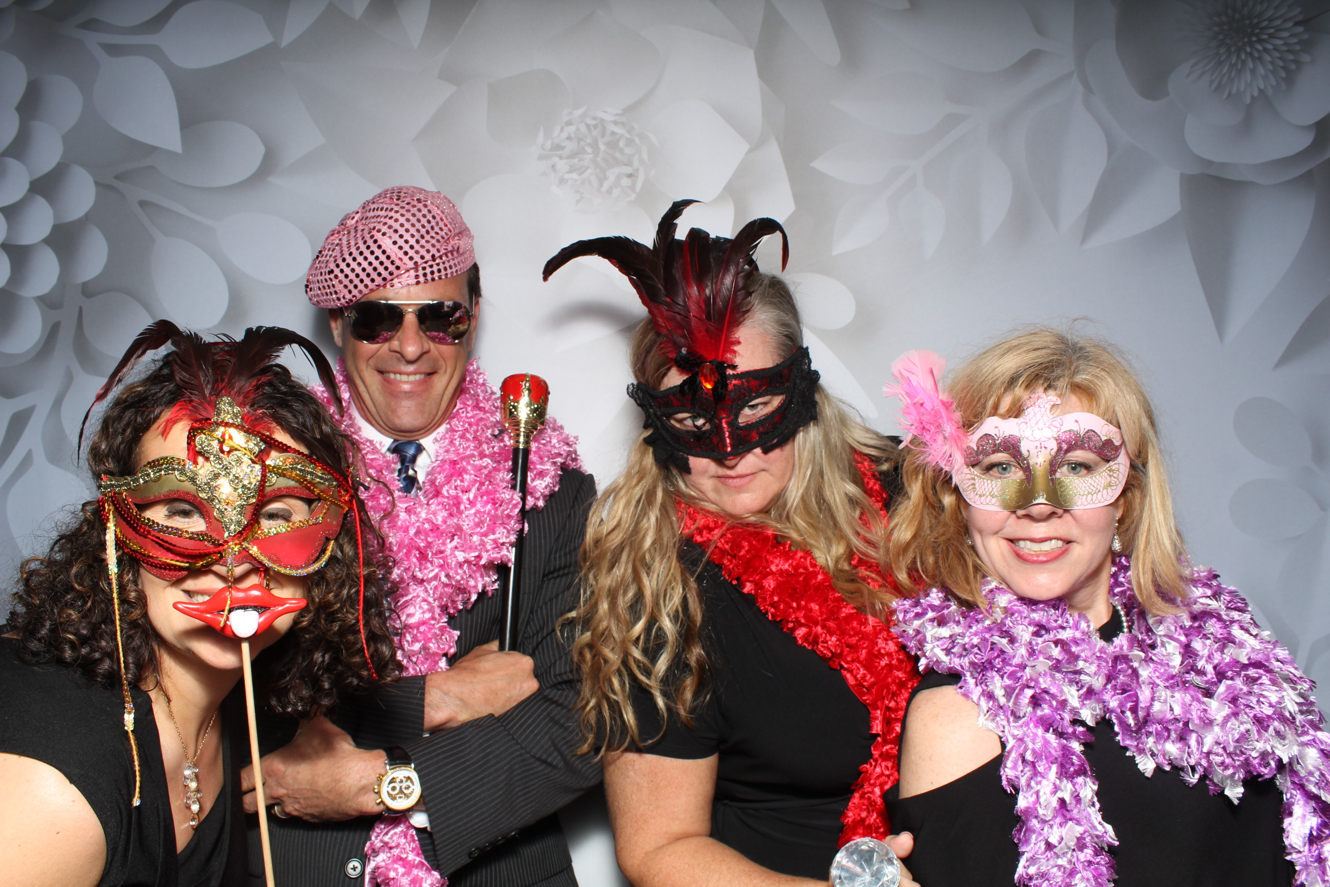 A group of people wearing masks and costumes.