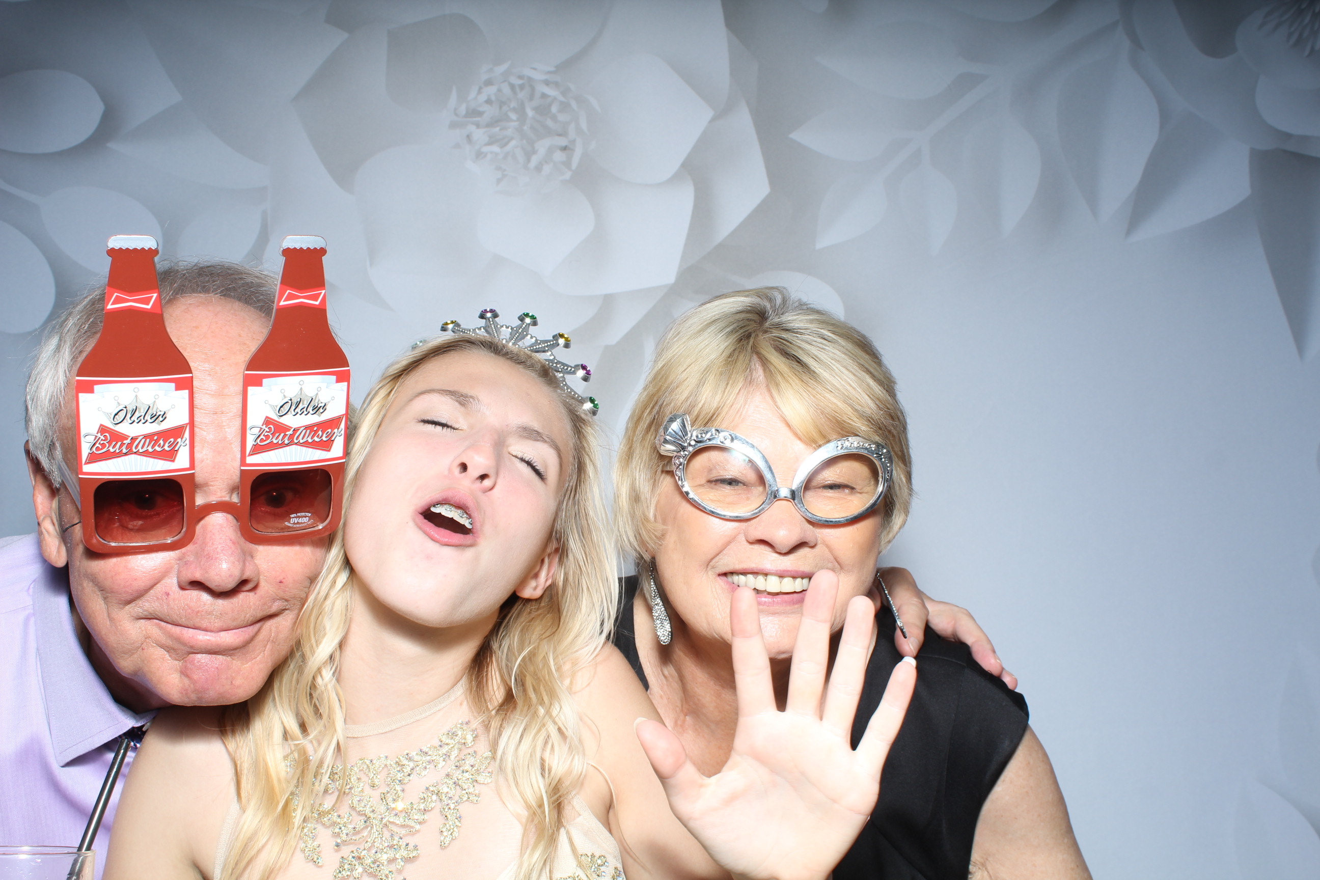 A group of people posing for the camera in a photo booth.