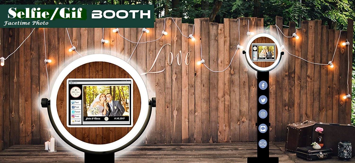 A photo booth with lights and a wooden fence.